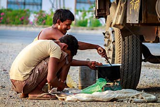 Men preparing his food (breakfast)