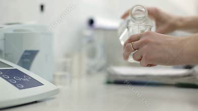 A technician is checking the quality of water