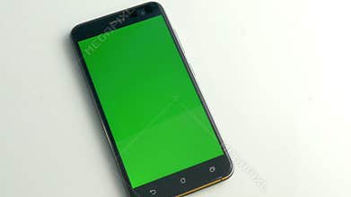 Smart phone with green screen on white