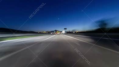 Fast driving at dusk.Vehicle shot