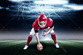 Composite image of american football player starting football game 3d