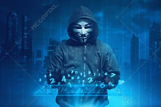 Hooded man with anonymous mask hacking system online security