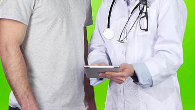 Woman doctor and man patient discussing treatment. Green screen