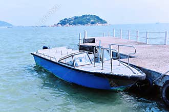 Boat docked at the seaside pier