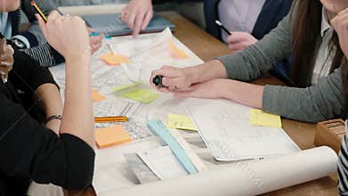 Close up brainstorm group of young architects Creative business team meeting in startup office discussing new ideas