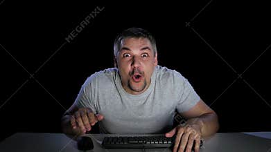 Man happily surprised by viewing news online. Emotions of surprise