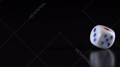 Dice throw on a black table