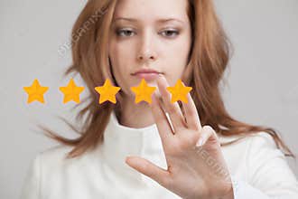 Five star rating or ranking, benchmarking concept. Woman assesses service, hotel, restaurant