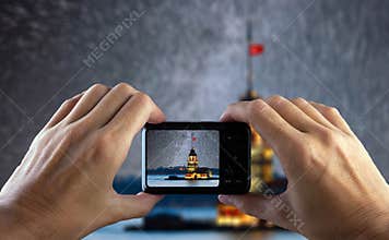 Travel concept. Hand making photo of city with camera. Istanbul. Turkey.