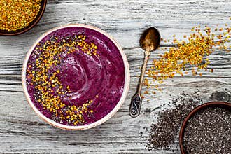 Acai breakfast superfoods smoothies bowl with chia seeds, bee pollen toppings. Immune boosting, anti inflammatory smoothie