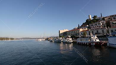 Smooth passage of the sailing vessel along the coast of Poros island