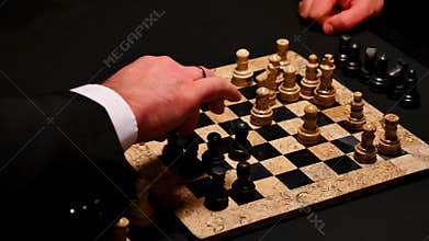 Close up footage of two players playing chess