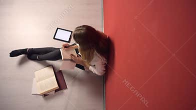 Persistent Young Student Girl Studying on Floor