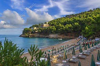 Apula coast,Gargano National Park: Pungnochiuso beach. Vieste,Italy.The bay is bounded by marvellous hills covered with age-old p
