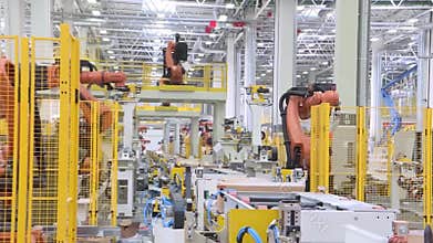 Technological production line at the plant. Scene. Team welding robots represent the movement. In the automotive parts
