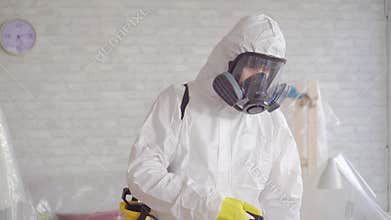 Close up of the exterminator cleans with a spray