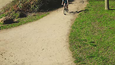 Young Man Cycling in the Early Morning