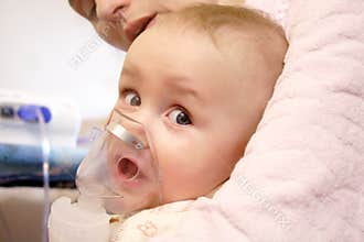 Baby with nebulizer mask