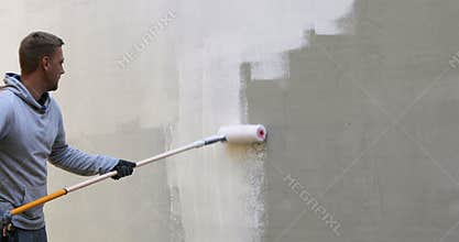 House painter painting building exterior
