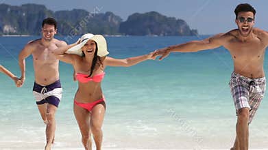 People Running From Water Holding Hands On Beautiful Beach, Man And Woman Group Friends On Sea Vacation