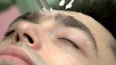 Close up of microcurrent therapy.