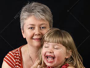 Mother and smiling daughter