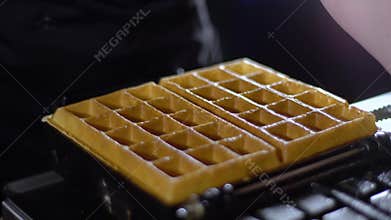 Waffles are taken from a waffle iron / cooked waffles
