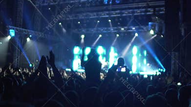 Hands of many excited people clapping in air, happy fans enjoying music concert