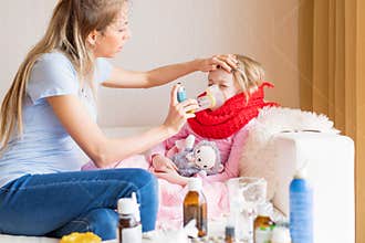 Mom treating sick child with cough