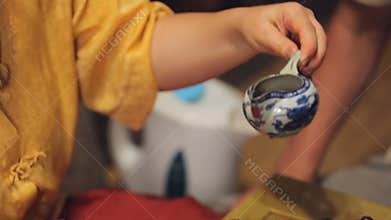 Male guest taking bowl participating Japan tea ritual event, spiritual content