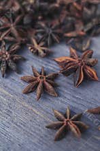 Star anise on wooden background