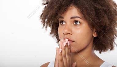 Portrait beautiful black woman praying, young girl with her hands together, closeup expression. Religion faith and
