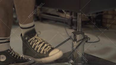 Barber lifting up chair in barber shop. Chair for hair cutting in hairdressing salon. Barber shop interior. Hair styling