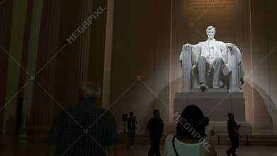 Camera follows a visitor into the lincoln memorial