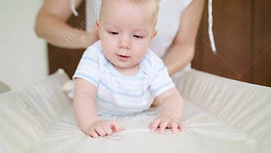 Changing swaddling clothes for the baby at home