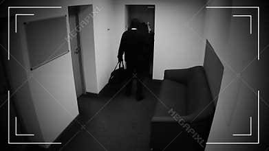 Two dangerous masked men disarming burglar alarm system, braking into bank vault