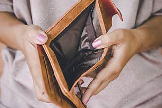 Woman hand open empty wallet looking for money having problem  bankrupt