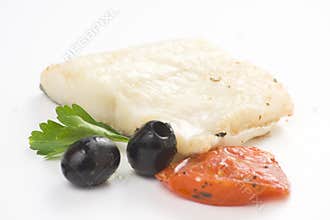 Fillet of cod baked tomatoes zucchini black olives