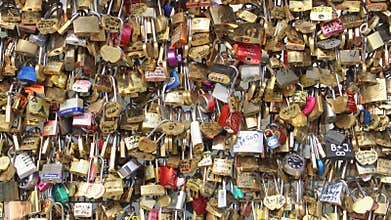 Paris, France- Circa August 2017: Bridge fence full of locks. Lovers Romantic Bridge in Paris