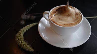 Woman Stirs Sugar with Spoon in Cup of Soy Cappuccino Coffee. Healthy Organic Vegan Diet Drinks Content. 4K.