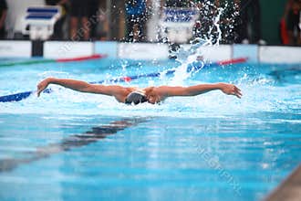 Blurry background of splash drop water on swimming race with swimming competition.