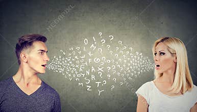 Language barrier concept. Handsome man talking to an attractive woman with many questions
