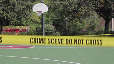 Basketball court, police tape at a crime scene
