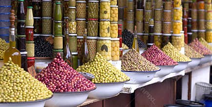 Olives on exhibitors for aperitifs and olive oil