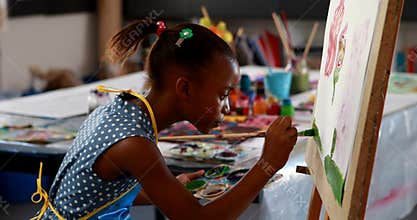 Cute schoolgirl painting on canvas 4k