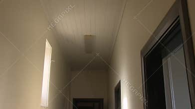 A white abandoned mansion hallway