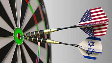 Flags of the USA and Israel on darts hitting bullseye of the target. International cooperation or competition conceptual