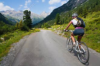 Girl riding fast on bicycle. Motion blur