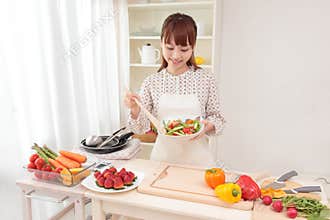 Woman cooking in kitchen