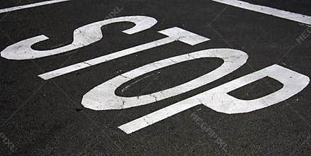 Stop painted on asphalt